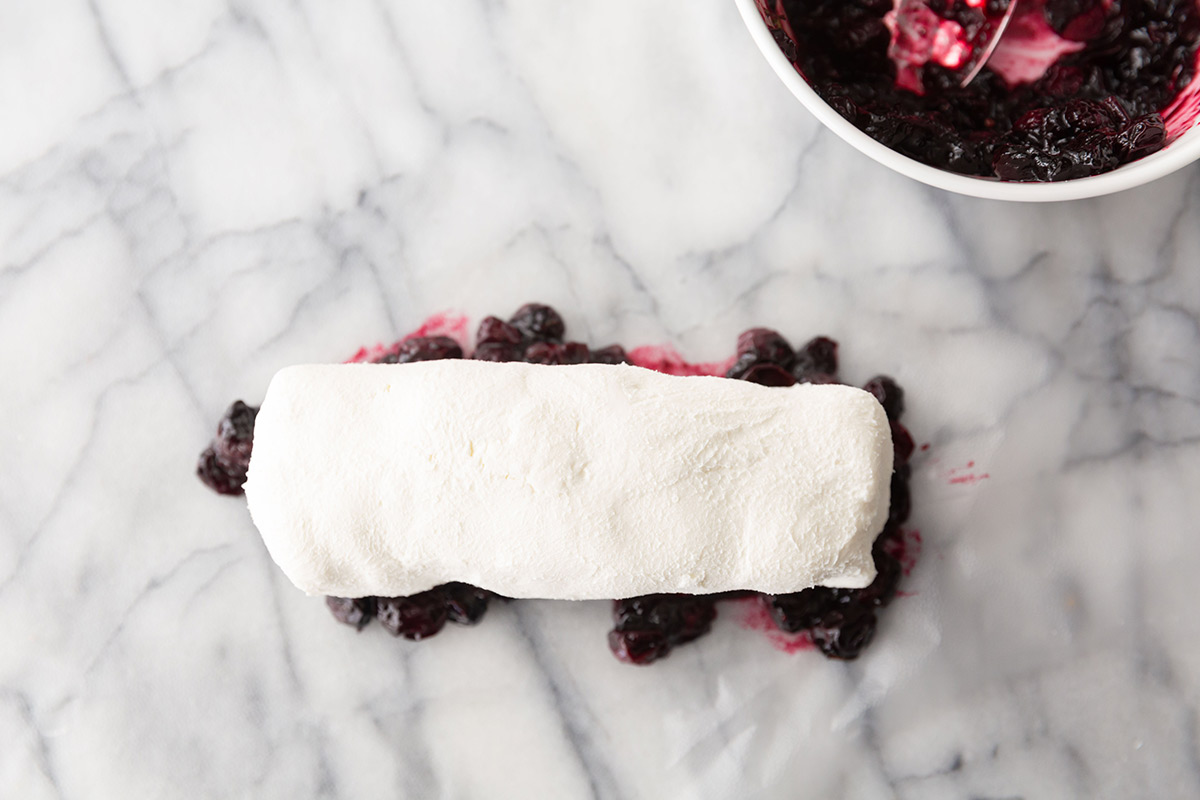 Making Blueberry Covered Goat Cheese Appetizer