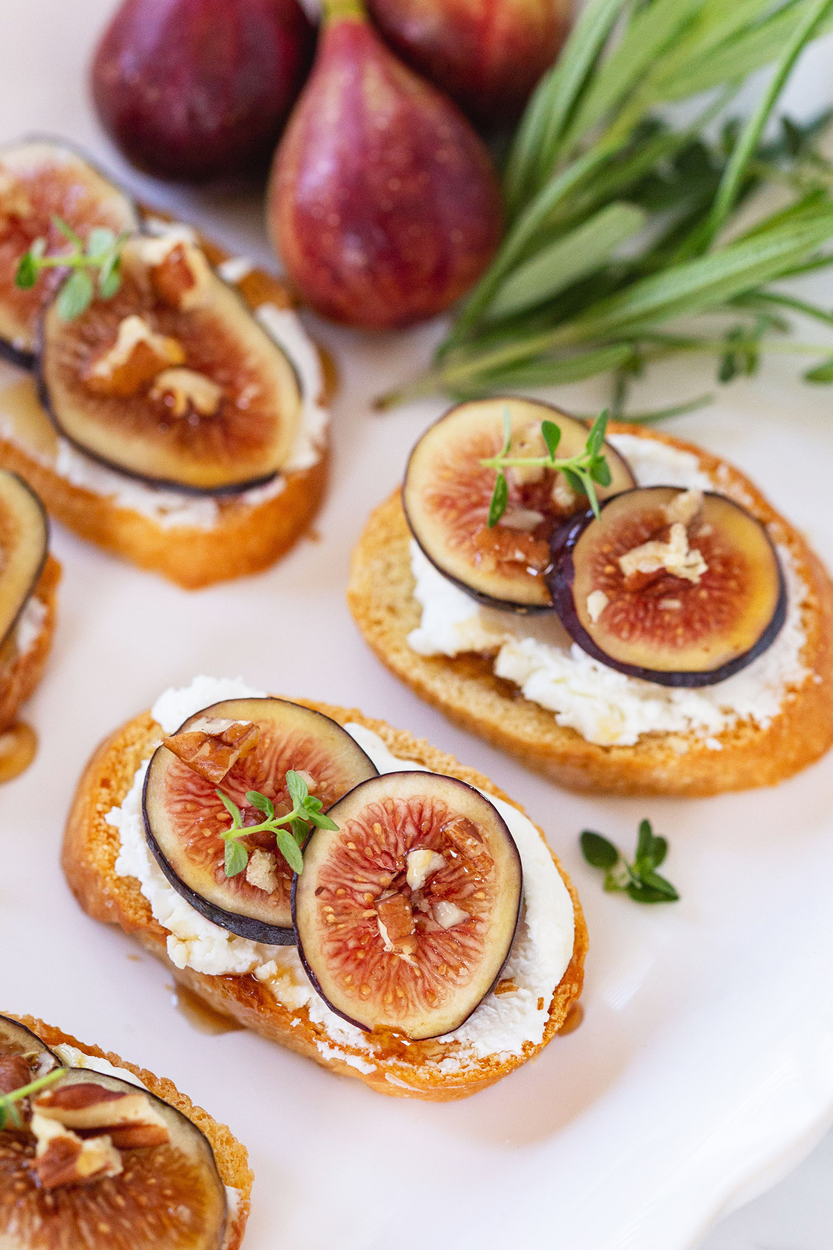 Fig and Goat Cheese Crostini with Honey and Chopped Pecans